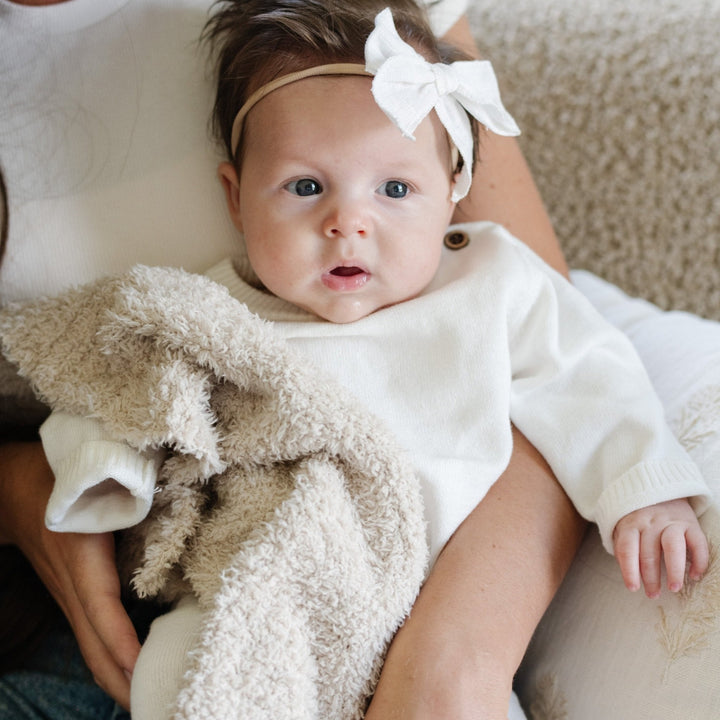 Your baby will love the delicate feel of the Saranoni BAMBONI¨ Mini Blanket in Buttermilk, a gentle and cozy baby blanket.