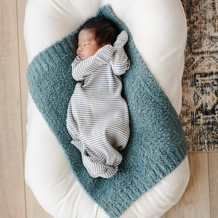 Perfect for toddlers, the Saranoni BAMBONI¨ Mini Blanket in Spruce adds comfort to any nap or cuddle time.