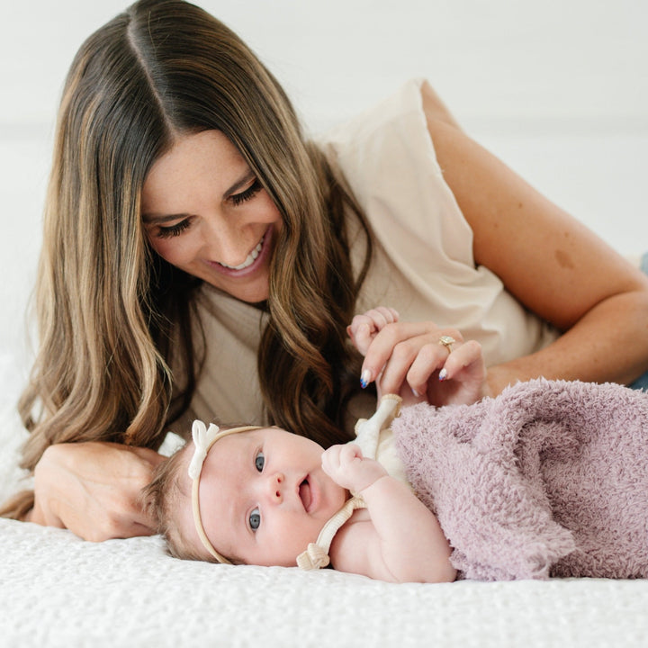 Your baby will love the cozy feel of the Saranoni BAMBONI¨ Mini Blanket in Woodrose Ñ a must-have among baby blankets.