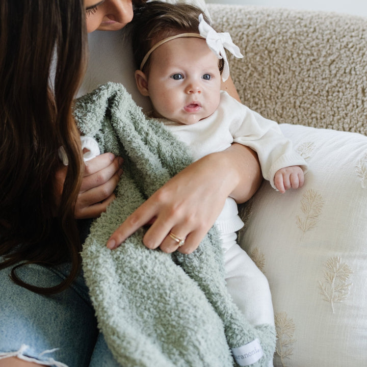 The Saranoni BAMBONI¨ Mini Blanket in Sage feels velvety and warm, making it the best baby blanket for everyday use.
