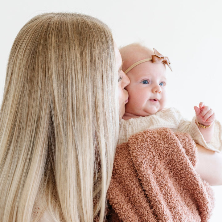 Cozy and stylish, the Saranoni BAMBONI¨ Mini Blanket in French Rose stands out as one of the best baby boy blankets.