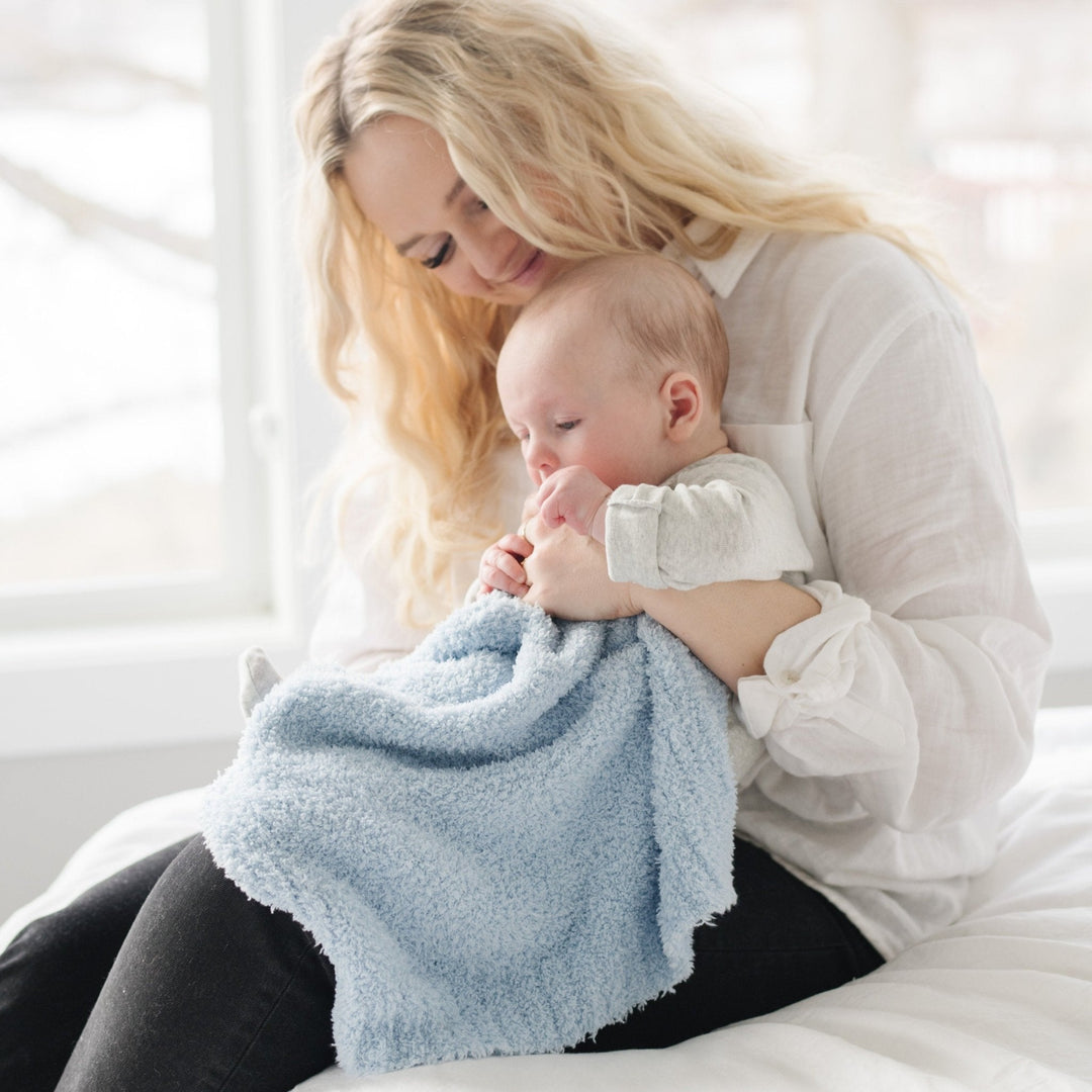 SaranoniÕs BAMBONI¨ Mini Blanket in Light Blue adds classic warmth, a must-have toddler blanket for chilly days.