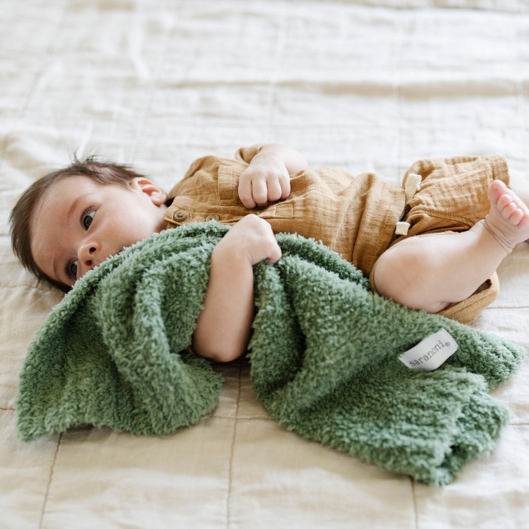 Cuddle time is better with the Saranoni BAMBONI¨ Mini Blanket in Olive, a cozy essential among toddler blankets.