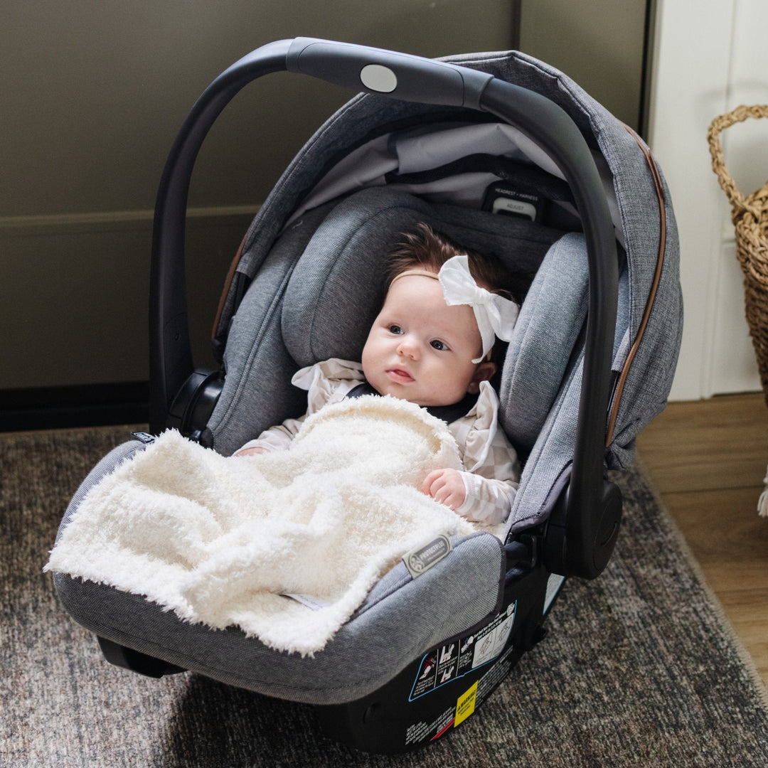SaranoniÕs BAMBONI¨ Mini Blanket in Ivory delivers plush comfort, making it one of the best baby blankets for all seasons.