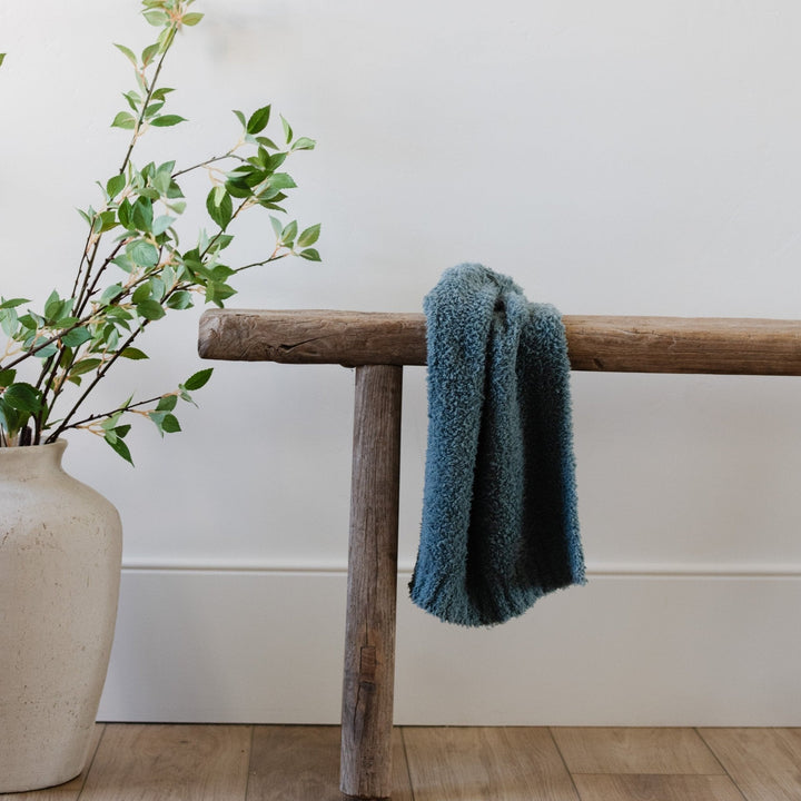 SaranoniÕs BAMBONI¨ Mini Blanket in Spruce delivers warmth and luxury, ranking among the best baby blankets.