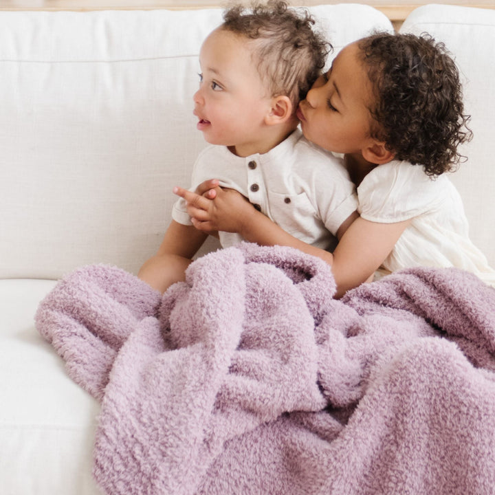 Experience unmatched softness with the Saranoni BAMBONI¨ Mini Blanket in Woodrose, one of the best baby blankets available.