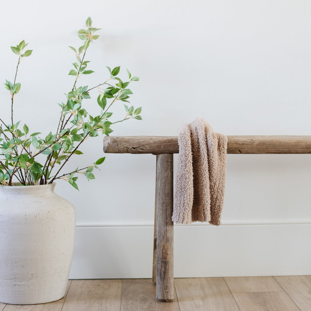 Soft and inviting, the Saranoni BAMBONI¨ Mini Blanket in Taupe wraps babies in warmth and love.