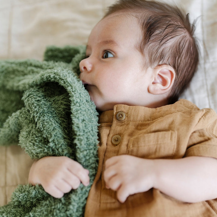 The Saranoni BAMBONI¨ Mini Blanket in Olive adds everyday luxury, ranking among the best toddler blankets for softness.