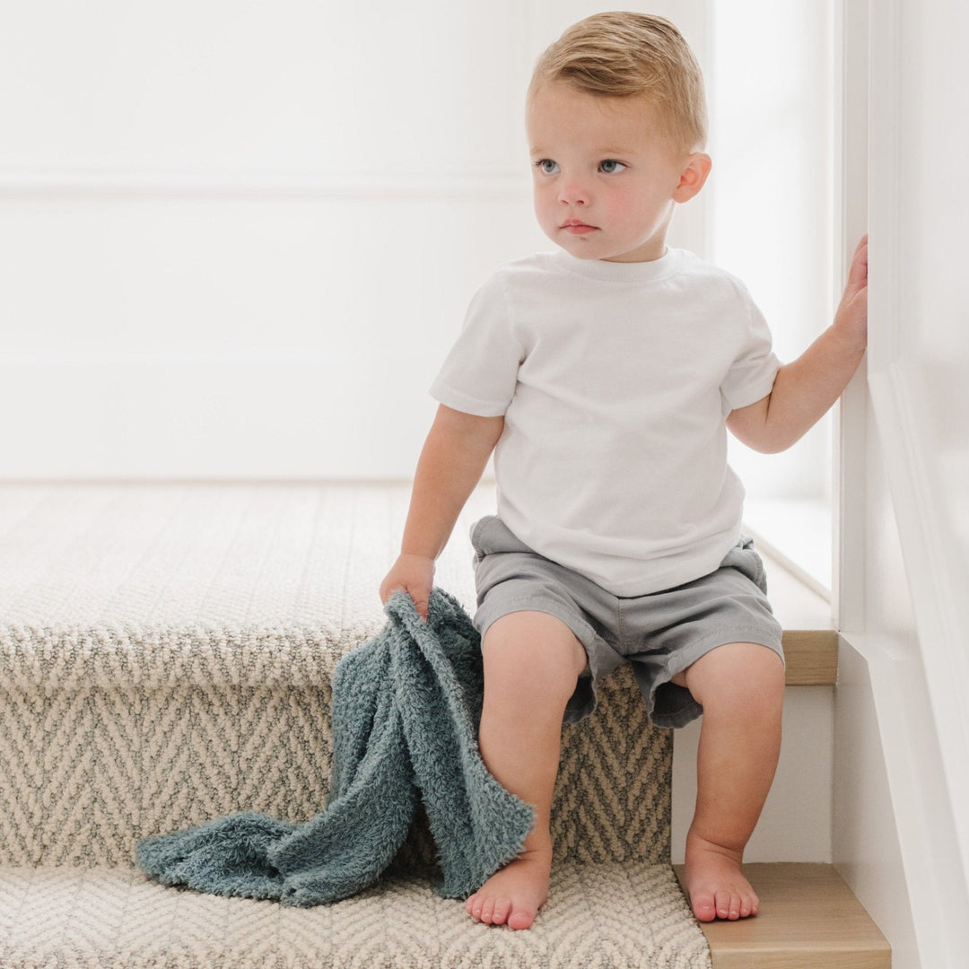 Soft hues and plush fabric make the Saranoni BAMBONI¨ Mini Blanket in Spruce, a beautiful baby girl blanket.