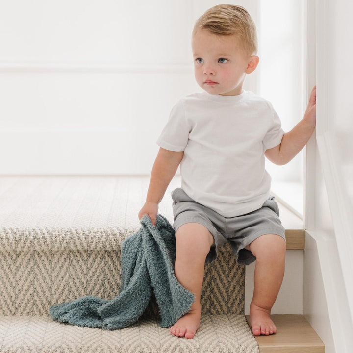 Soft hues and plush fabric make the Saranoni BAMBONI¨ Mini Blanket in Spruce, a beautiful baby girl blanket.