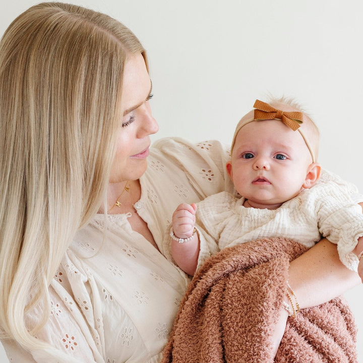 The Saranoni BAMBONI¨ Mini Blanket in French Rose surrounds your baby in softness, a beautiful and gentle baby blanket.