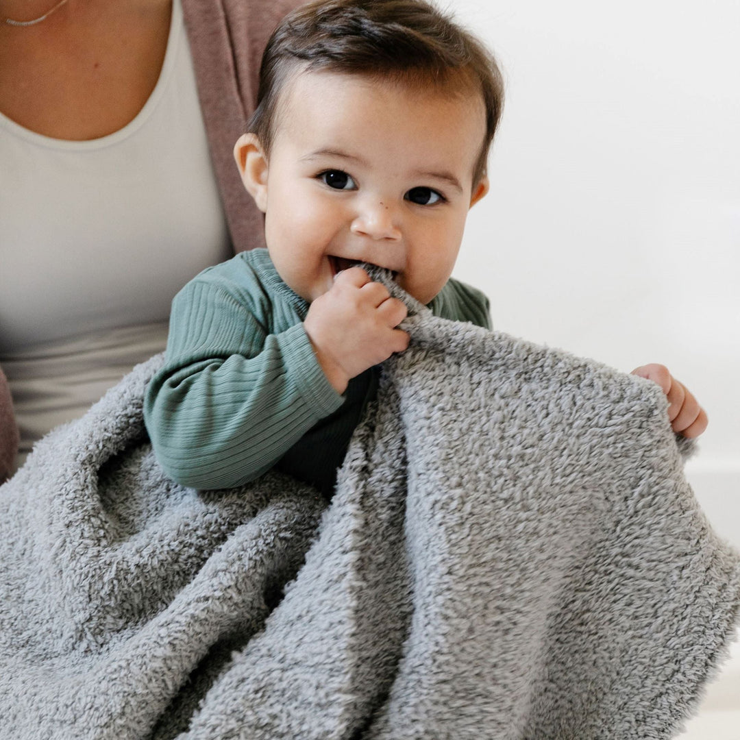 Cuddle your baby in the Saranoni Bamboni¨ Receiving Blanket in Gray, a cozy favorite among baby blankets.