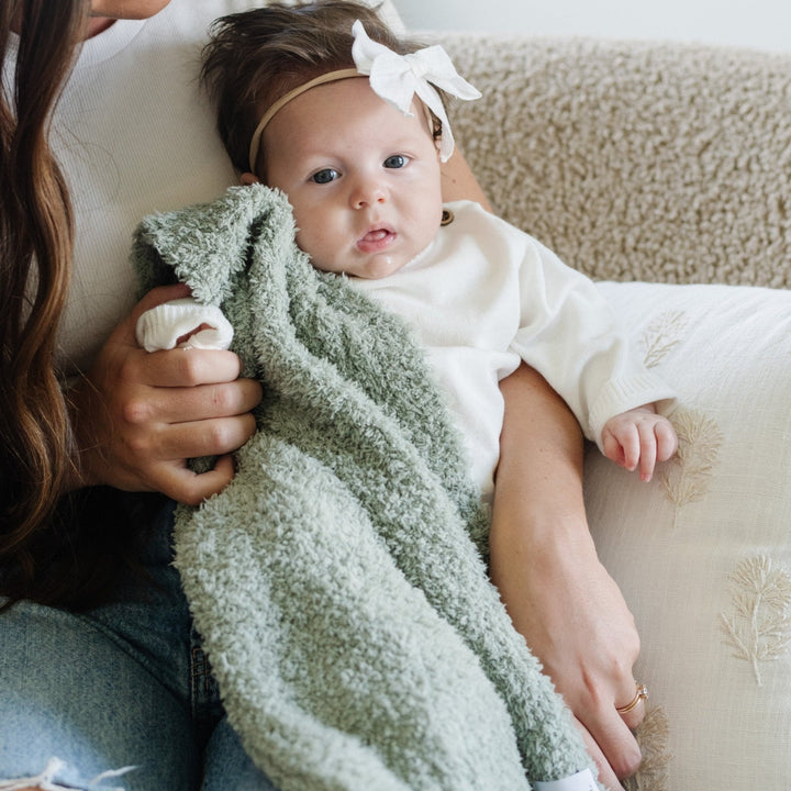 Wrap your little one in the Saranoni Bamboni¨ Receiving Blanket in Sage, a cozy and classic baby boy blanket.