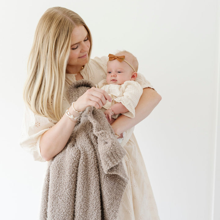 The Saranoni Bamboni¨ Receiving Blanket in Taupe blends elegance and softness, perfect for baby girl blankets.