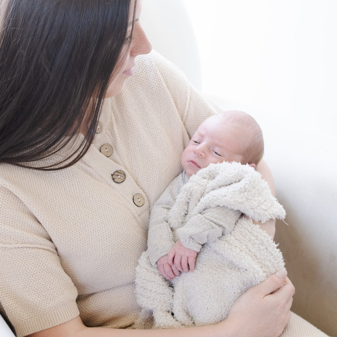 Soft and inviting, the Saranoni Bamboni¨ Receiving Blanket in Buttermilk offers timeless comfort for newborns.