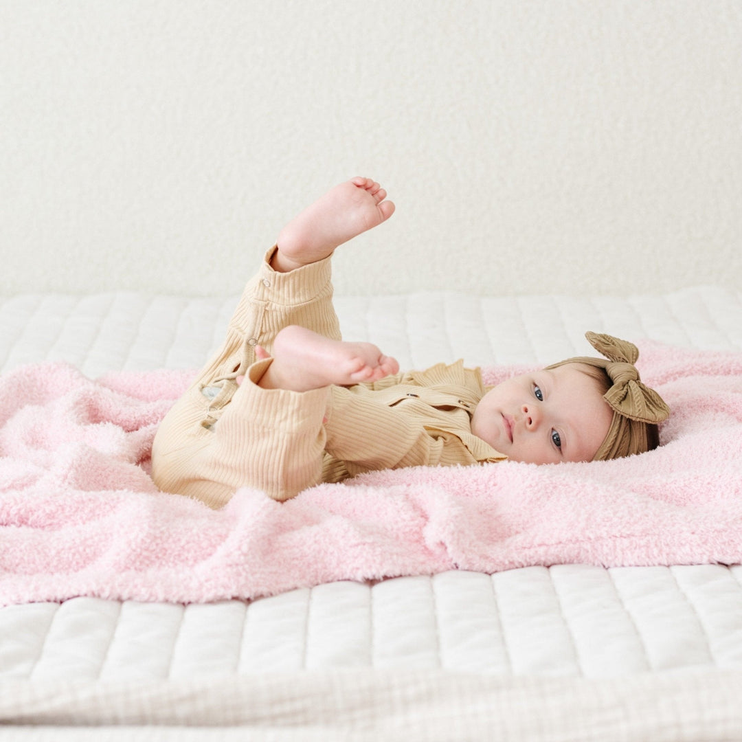 The Saranoni Bamboni¨ Receiving Blanket in Light Pink surrounds your baby in luxury, a perfect baby receiving blanket.