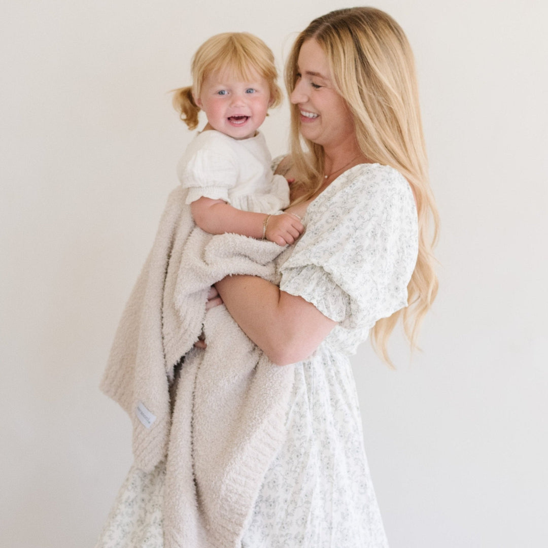 The Saranoni Bamboni¨ Receiving Blanket in Buttermilk feels luxuriously smooth, perfect for best baby blankets.