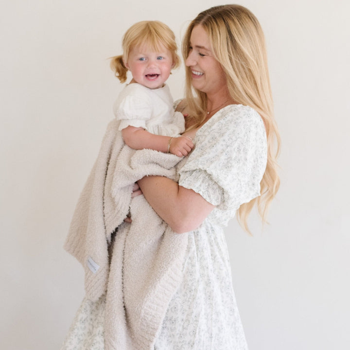 The Saranoni Bamboni¨ Receiving Blanket in Buttermilk feels luxuriously smooth, perfect for best baby blankets.