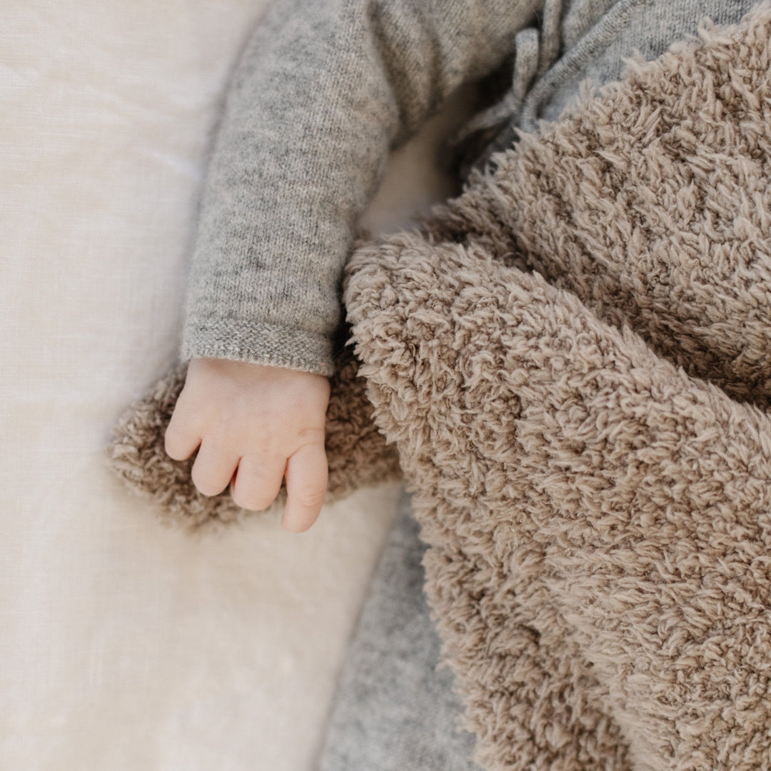 Wrap your newborn in plush warmth with the Saranoni Bamboni¨ Receiving Blanket in Taupe, a must-have baby blanket.