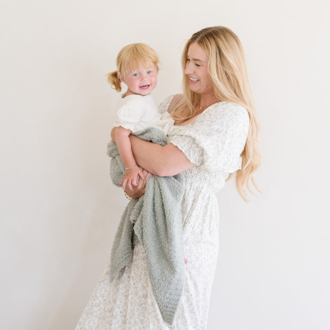 SaranoniÕs Bamboni¨ Receiving Blanket in Sage brings plush texture and gentle warmth to every cuddle.