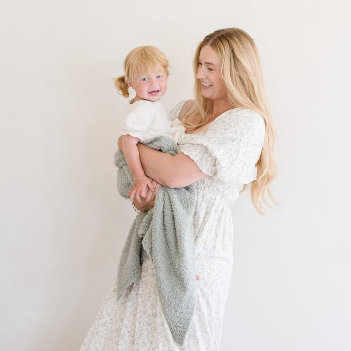SaranoniÕs Bamboni¨ Receiving Blanket in Sage brings plush texture and gentle warmth to every cuddle.