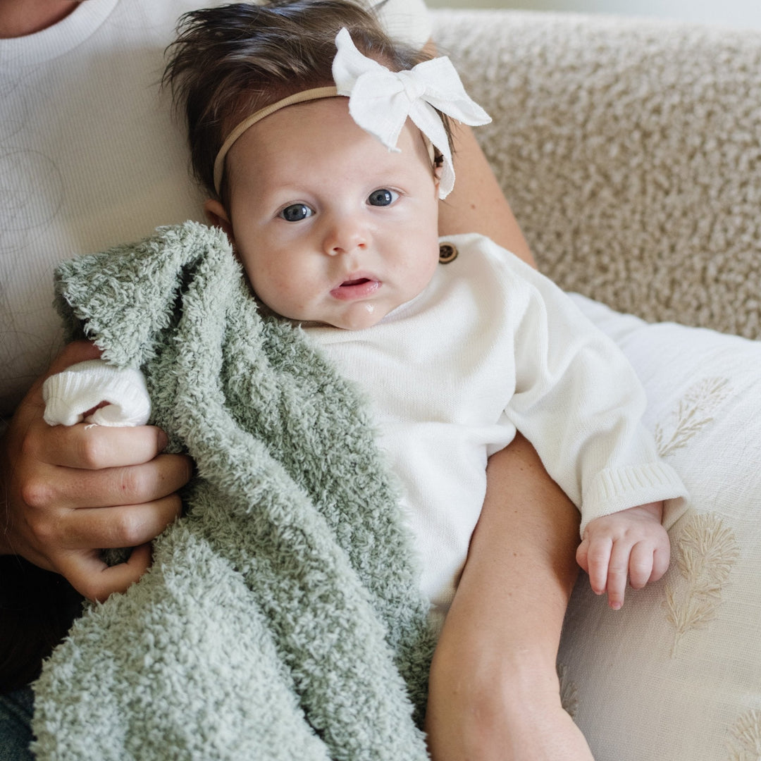 Keep your newborn comfortable in the Saranoni Bamboni¨ Receiving Blanket in Sage Green, crafted for soft baby blankets.