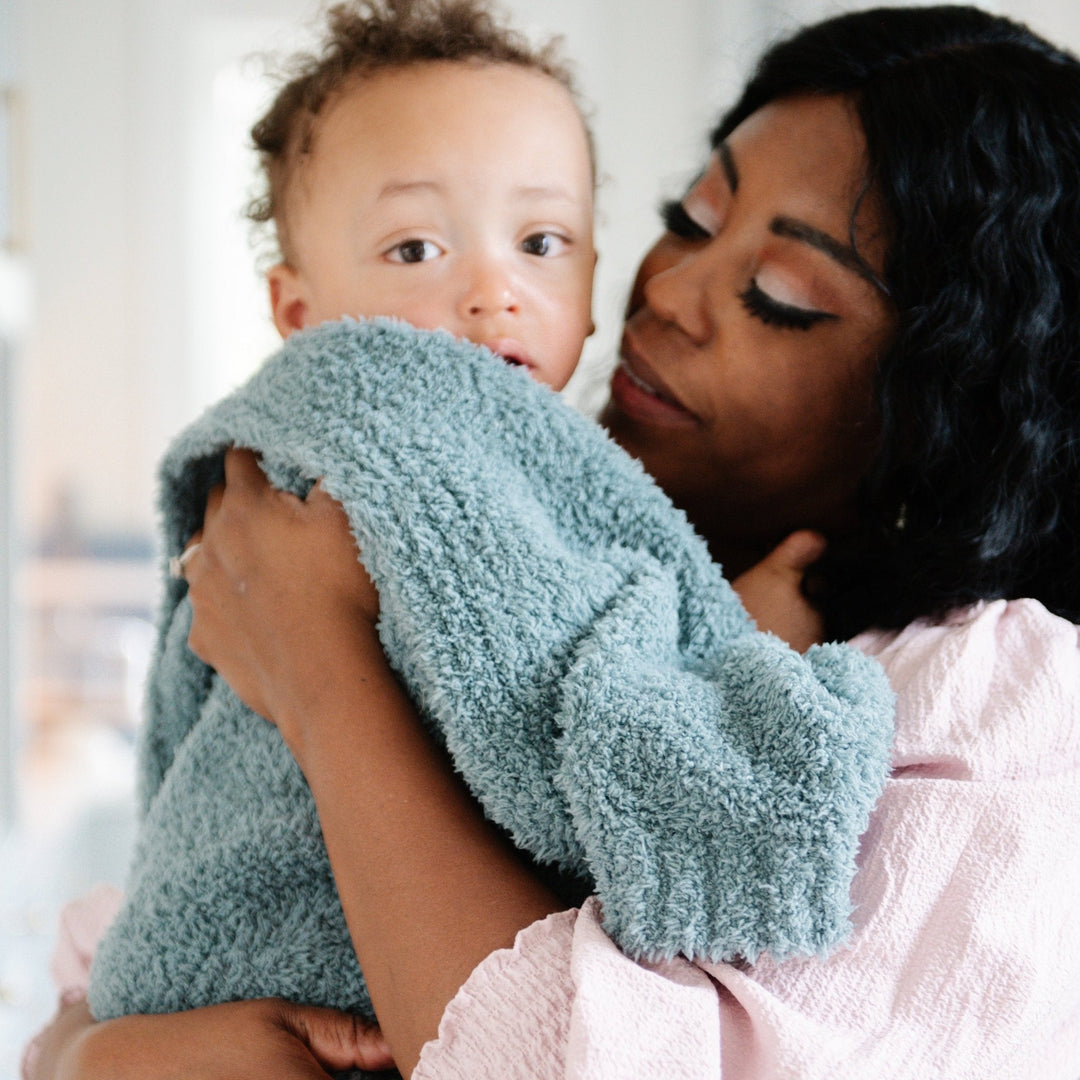 Wrap your little one in the Saranoni Bamboni¨ Receiving Blanket in Spruce, a must-have for soft baby blankets.