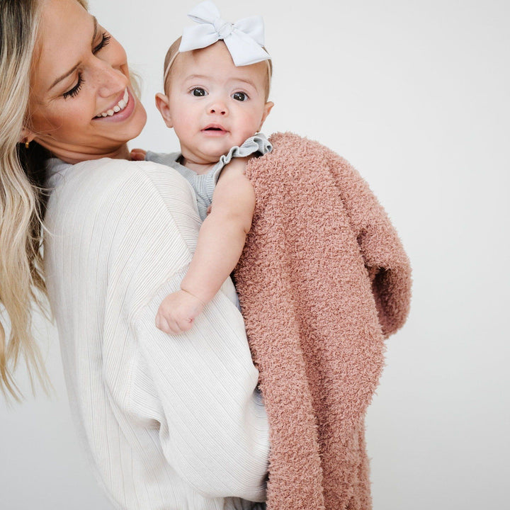 SaranoniÕs Bamboni¨ Receiving Blanket in French Rose offers cloud-soft coziness, the best baby blanket for any season.
