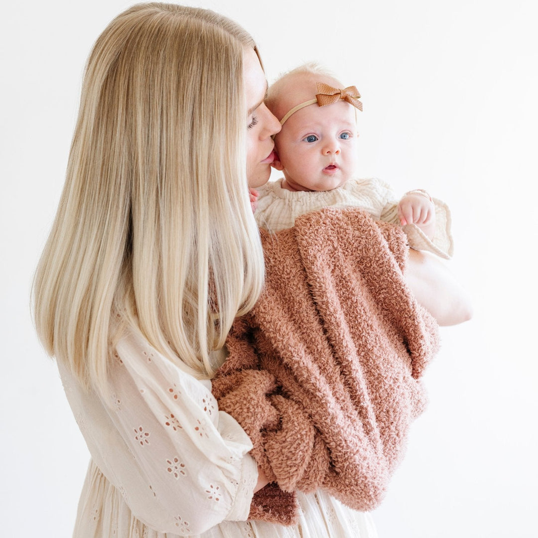 The Saranoni Bamboni¨ Receiving Blanket in French Rose brings calm and comfort, perfect for baby receiving blankets.