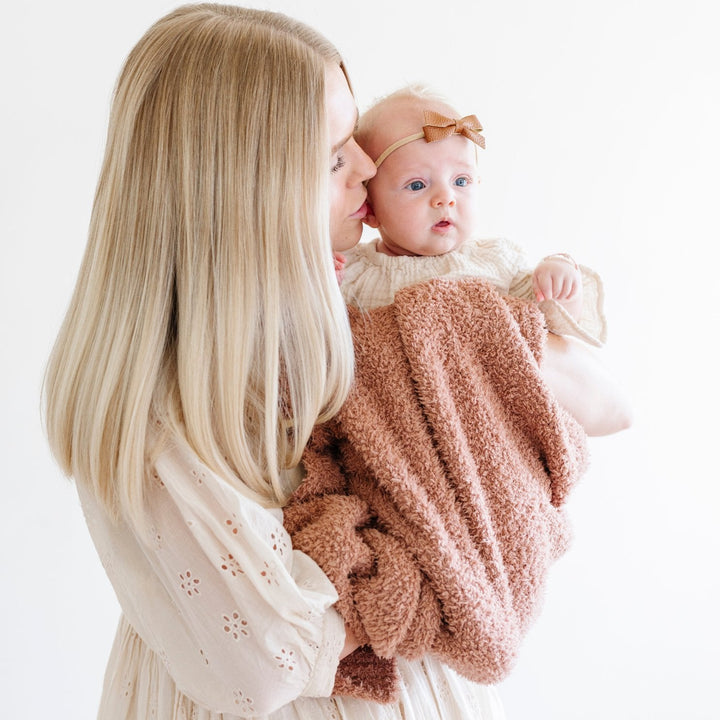 The Saranoni Bamboni¨ Receiving Blanket in French Rose brings calm and comfort, perfect for baby receiving blankets.