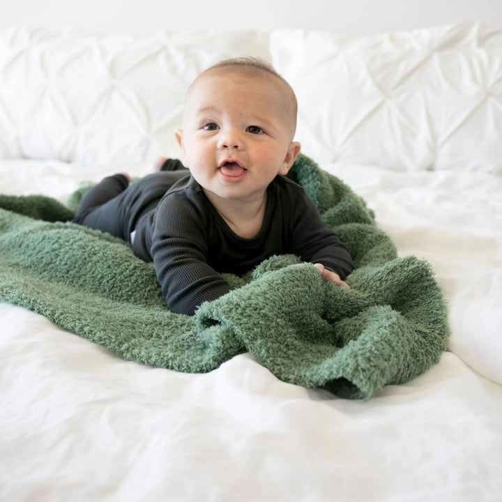 The Saranoni Bamboni¨ Receiving Blanket in Olive adds warmth and charm, one of the best baby girl blankets.