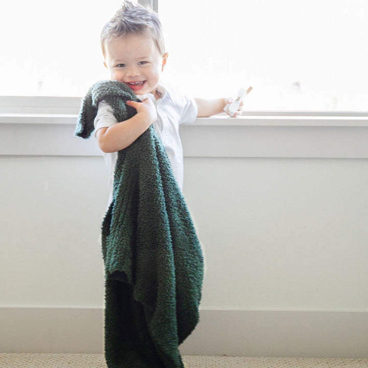 The Saranoni Bamboni¨ Receiving Blanket in Juniper surrounds your baby in plush comfort, one of the best baby blankets.
