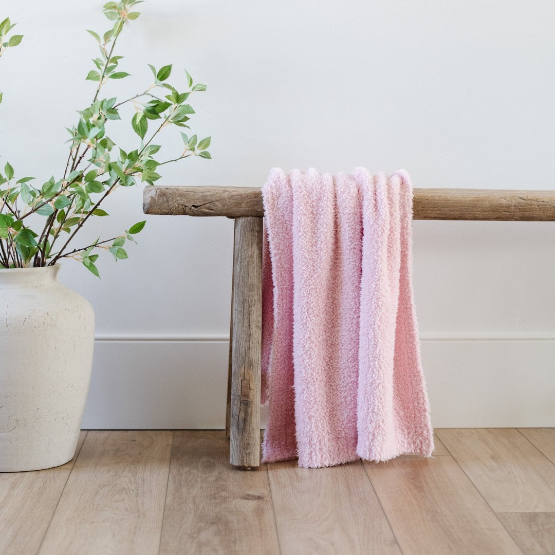 Snuggle your infant in the Saranoni Bamboni¨ Receiving Blanket in Light Pink, a plush and soft baby blanket.