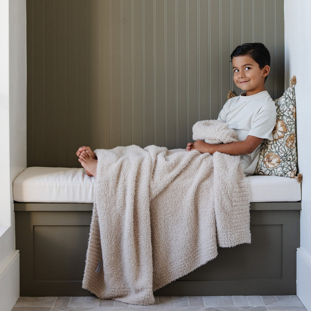 Soft Buttermilk Saranoni BAMBONI¨ Toddler Blanket, ideal for snuggles as a best toddler blankets.