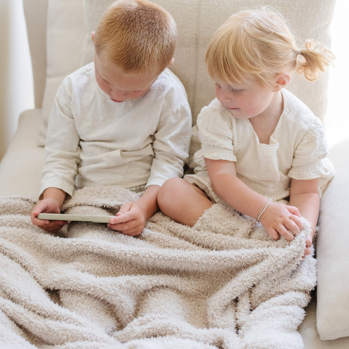Gentle Buttermilk Saranoni BAMBONI¨ Toddler Blanket, soft and warm, perfect among toddler blankets.