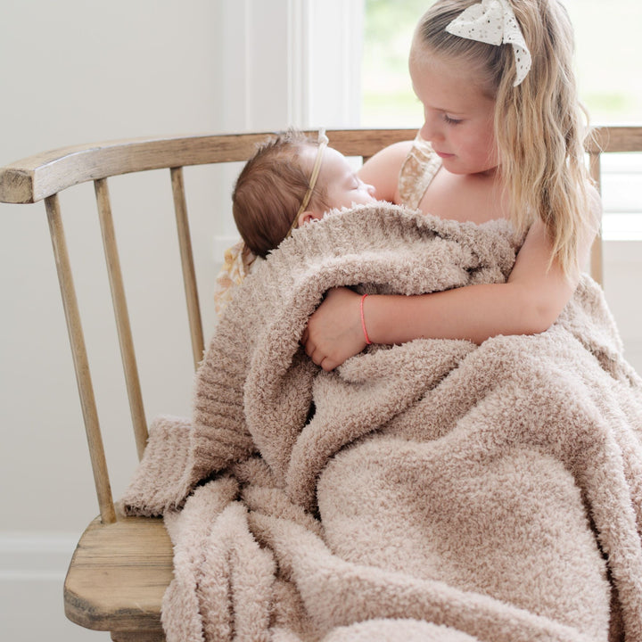 Wrap little ones in the Birch Saranoni BAMBONI¨ Toddler Blanket, a best toddler blanket pick.