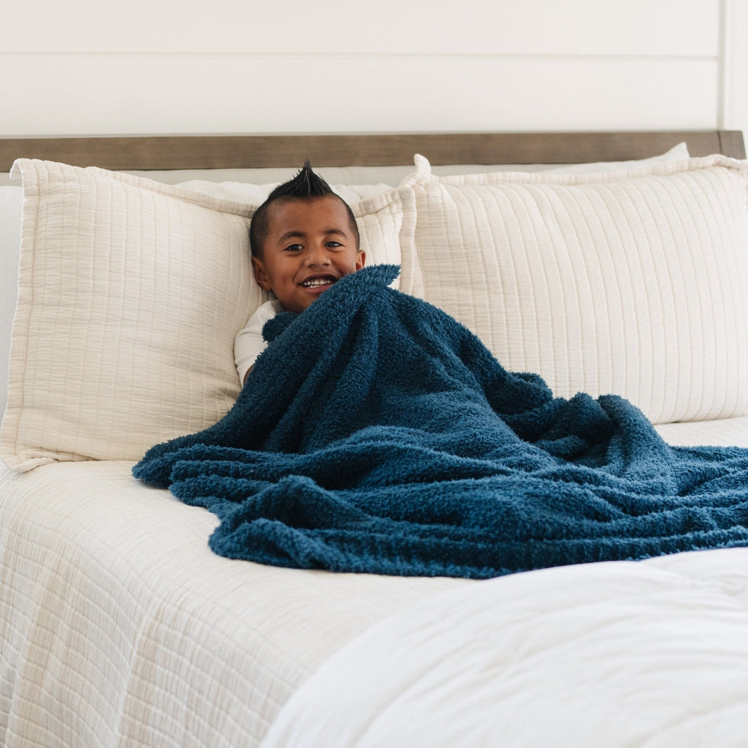 The Nautical Blue BAMBONI¨ Toddler Blanket by Saranoni brings gentle comfort, perfect for best blanket for toddler.