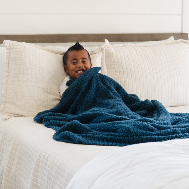 The Nautical Blue BAMBONI¨ Toddler Blanket by Saranoni brings gentle comfort, perfect for best blanket for toddler.