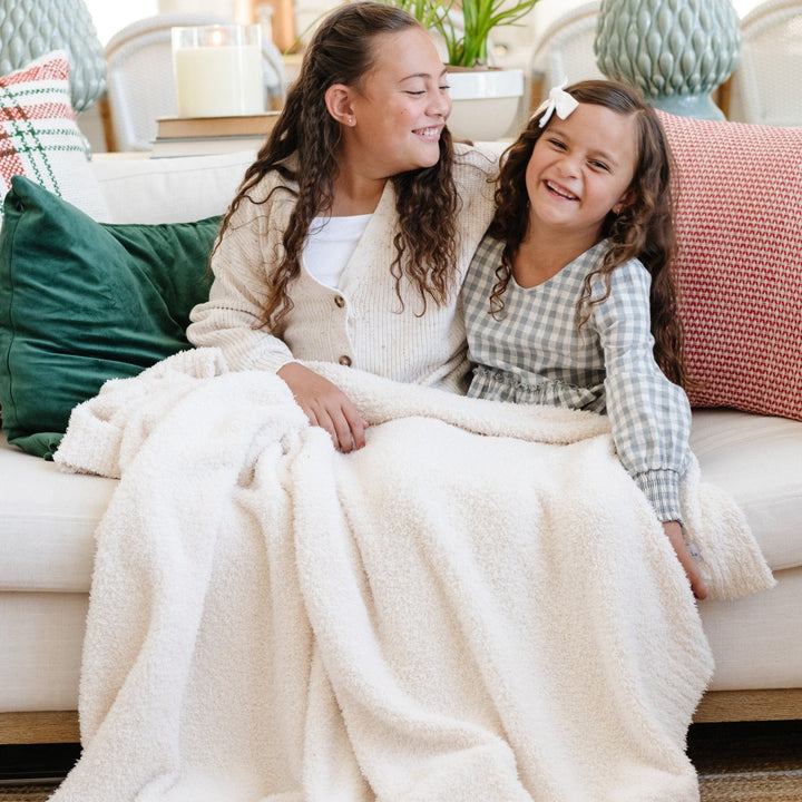 Little ones love the Ivory Saranoni BAMBONI¨ Toddler Blanket, a best blanket for toddler pick.