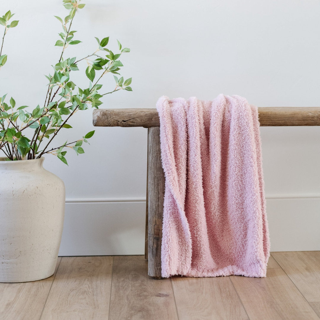 Cuddle-ready Light Pink Saranoni BAMBONI¨ Toddler Blanket, a favorite among best baby blankets.