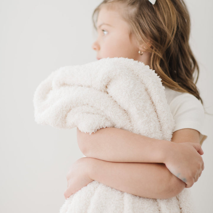 Ultra-soft Ivory BAMBONI¨ Toddler Blanket by Saranoni, ideal for toddler blankets snuggles.