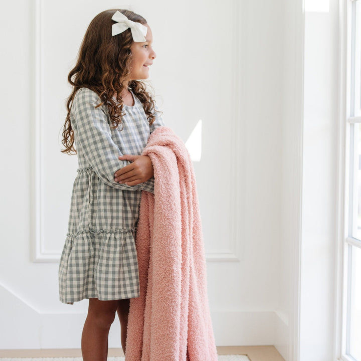 Wrap your toddler in the Peach BAMBONI¨ Toddler Blanket by Saranoni, a soft baby girl blankets option.