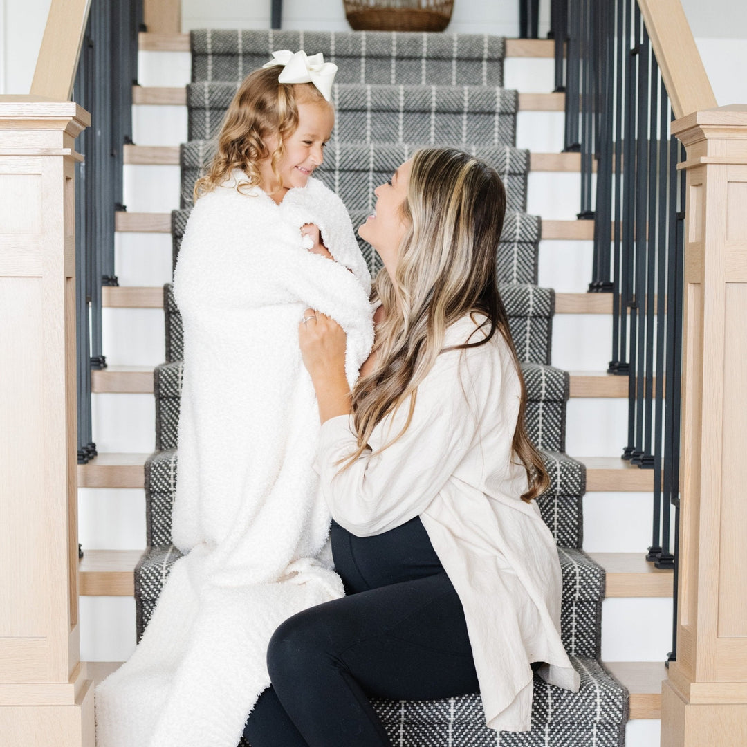 Wrap your little one in the Ivory Saranoni BAMBONI¨ Toddler Blanket, a best toddler blanket choice.