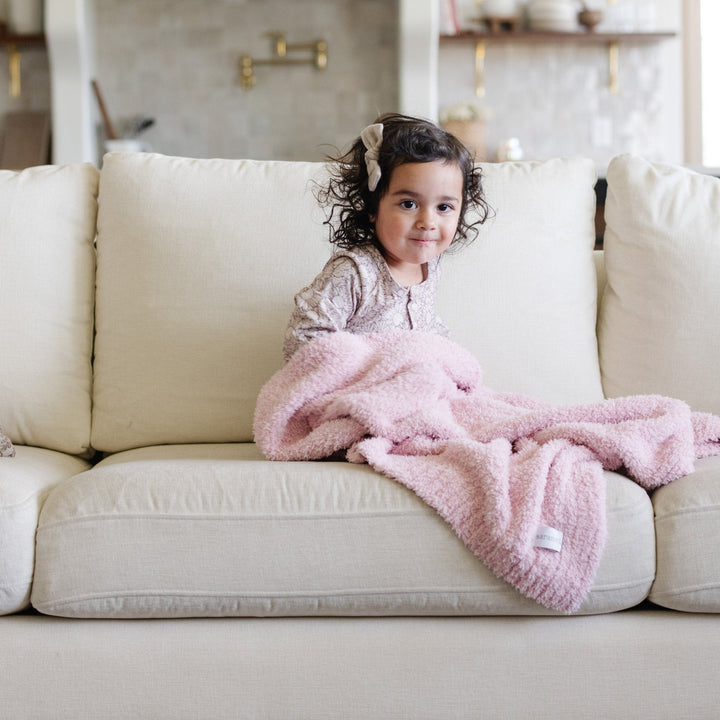 The Light Pink BAMBONI¨ Toddler Blanket from Saranoni is soft, cozy, and great for baby girl blankets.