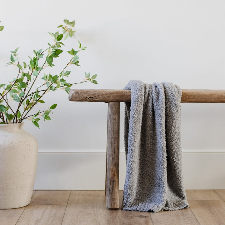 Cuddle-ready Gray BAMBONI¨ Toddler Blanket by Saranoni, an ideal baby blankets choice.