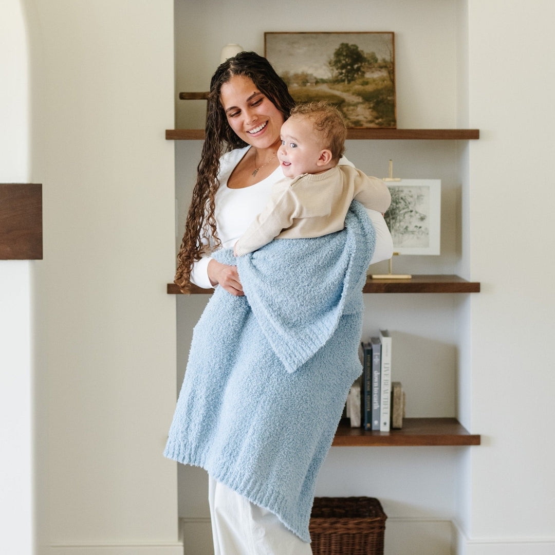 The Light Blue BAMBONI¨ Toddler Blanket by Saranoni wraps toddlers in warmth, a best baby blanket pick.