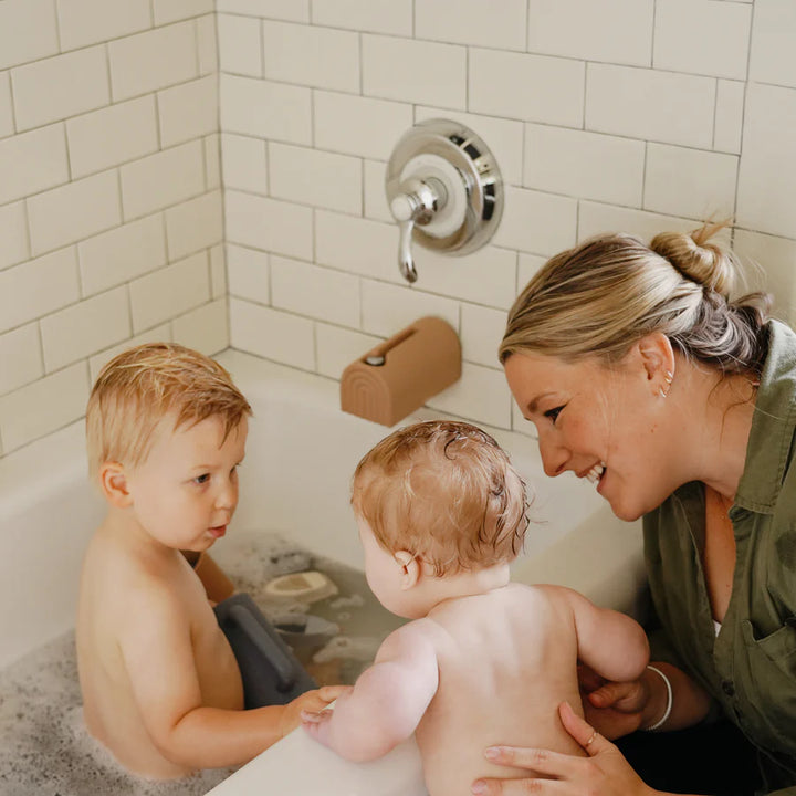 Mushie Bathtime Spout Cover Another view of the Mushie bathtime spout cover made to keep babies safe from hard faucet edges