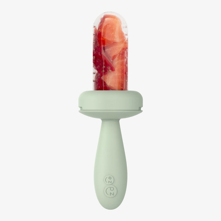Shown in Sage, the EZPZ Baby-Ledª Gumline Feeder pairs well with a baby silicone feeding set for teething support