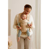 baby wearing babybjorn mini