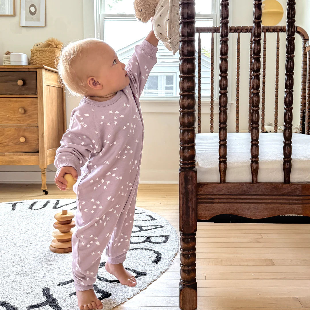 Adorable Gunamuna Fleece Jumpsuit in Birdie, stylish baby clothing ideal for naps and playtime.